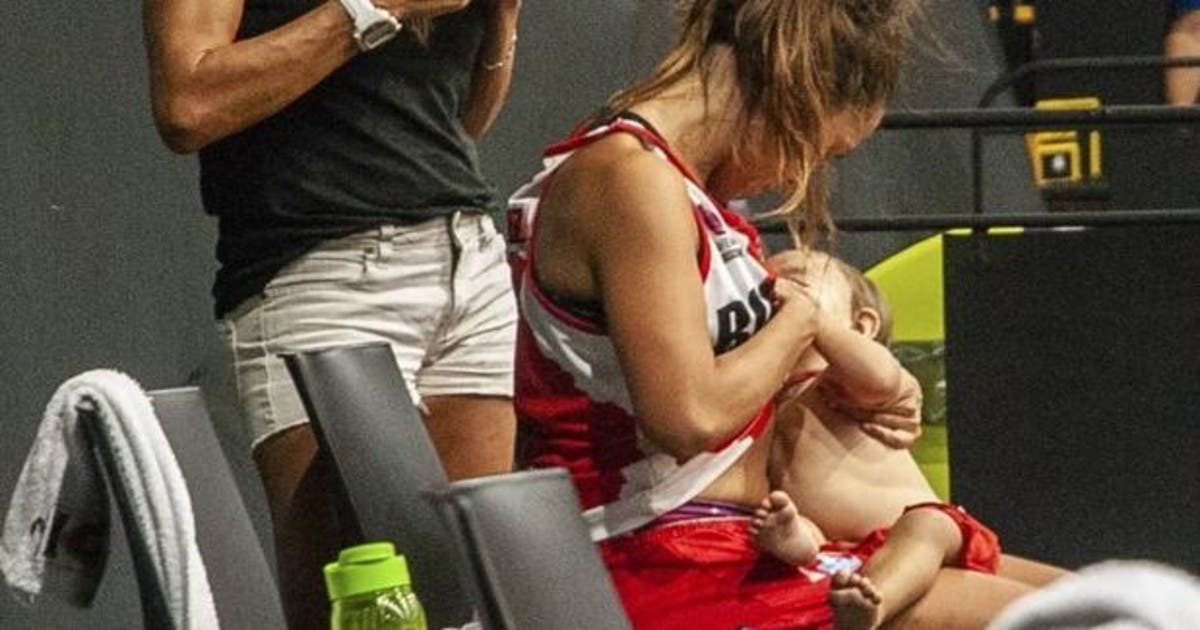 Viral photo of a basketball player breastfeeding his baby during a game